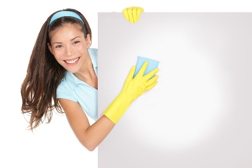 Professional carpet cleaner reviewing booking details before arrival