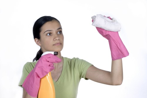 Upholstery cleaner treating a chair with specialist equipment